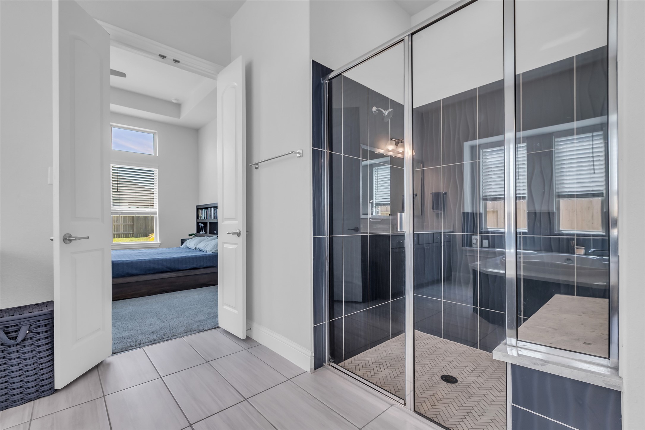 423 Round Top Street Webster, TX 77598 - Photo 26 of 49 a bathroom with a shower and a sink