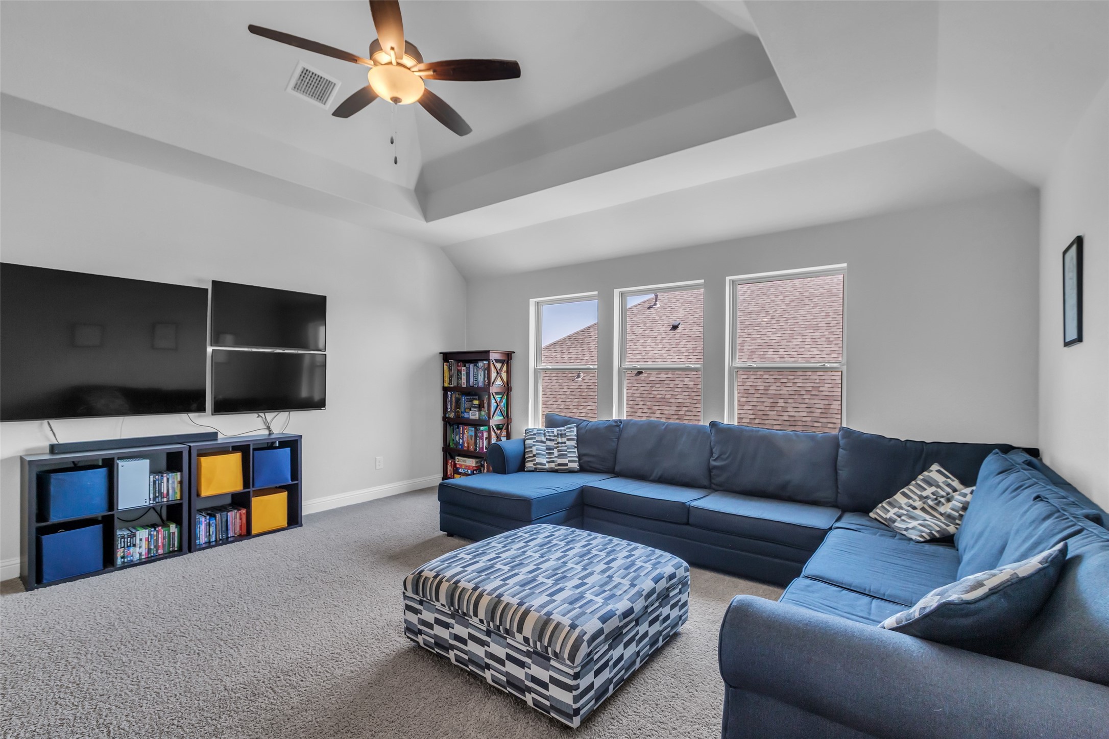 423 Round Top Street Webster, TX 77598 - Photo 30 of 49 a living room with furniture and a flat screen tv