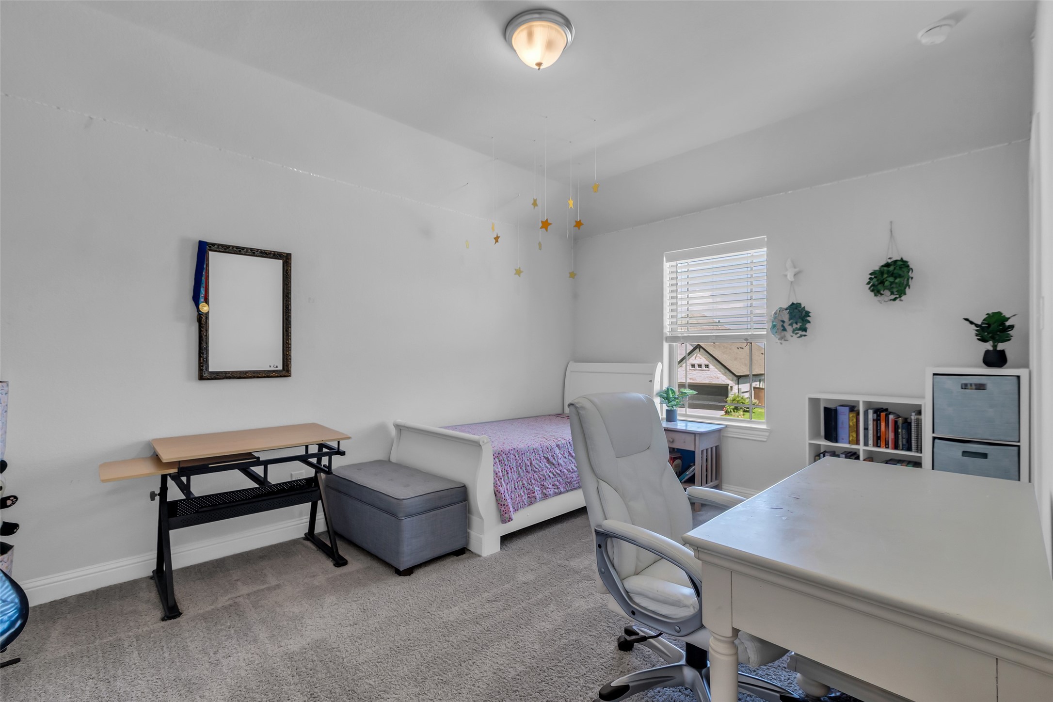 423 Round Top Street Webster, TX 77598 - Photo 33 of 49 a living room with furniture and a table