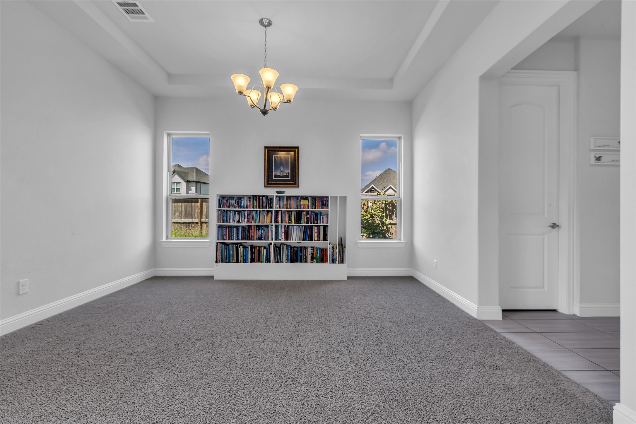 423 Round Top Street Webster, TX 77598 - Photo 8 of 49 a view of an empty room with a window and fireplace