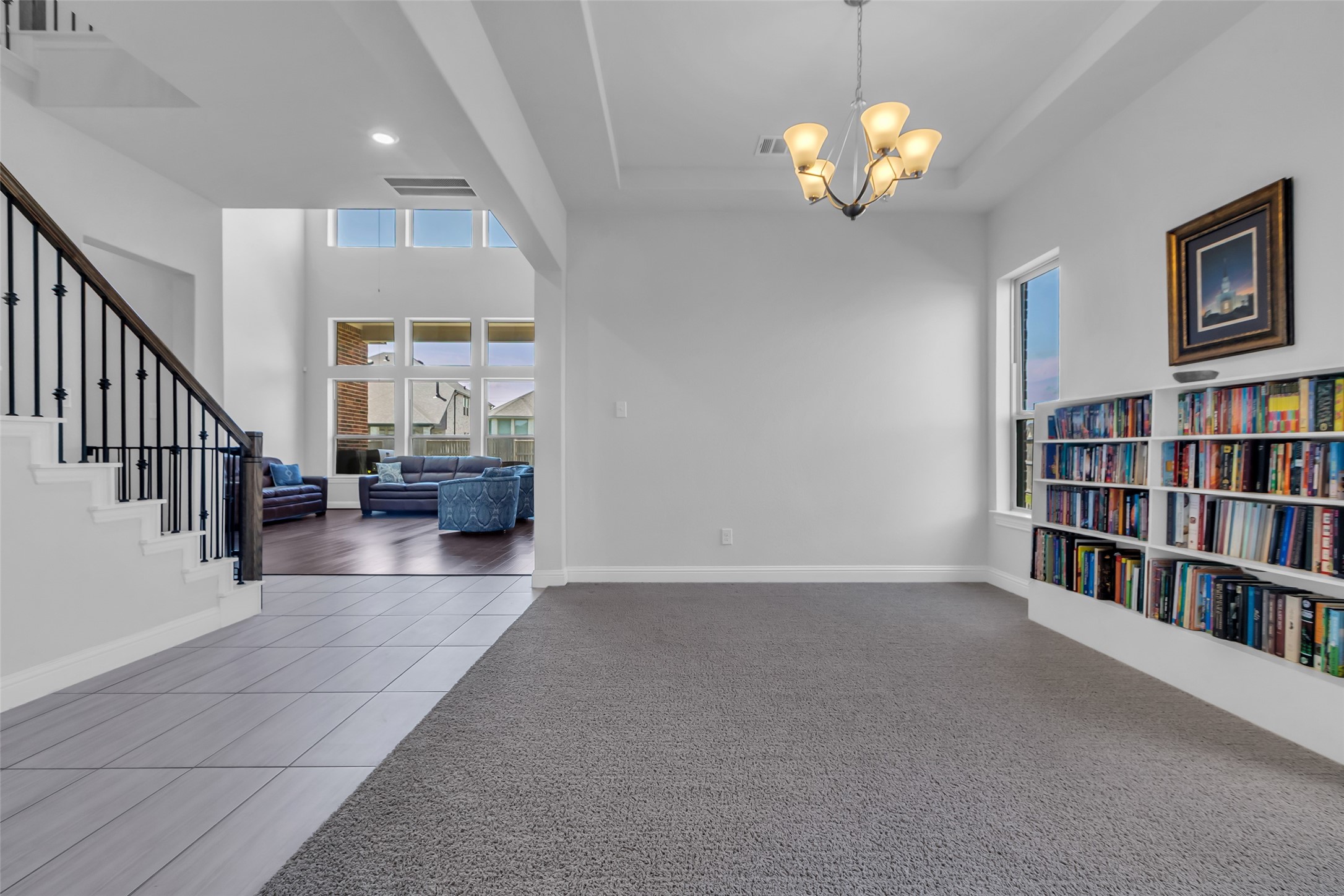 423 Round Top Street Webster, TX 77598 - Photo 9 of 49 a view of a livingroom with a ceiling fan and staircase
