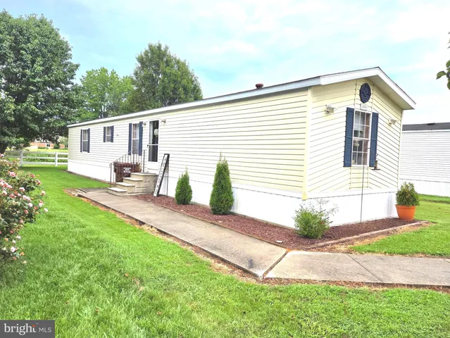 a view of a backyard with a garden and plants