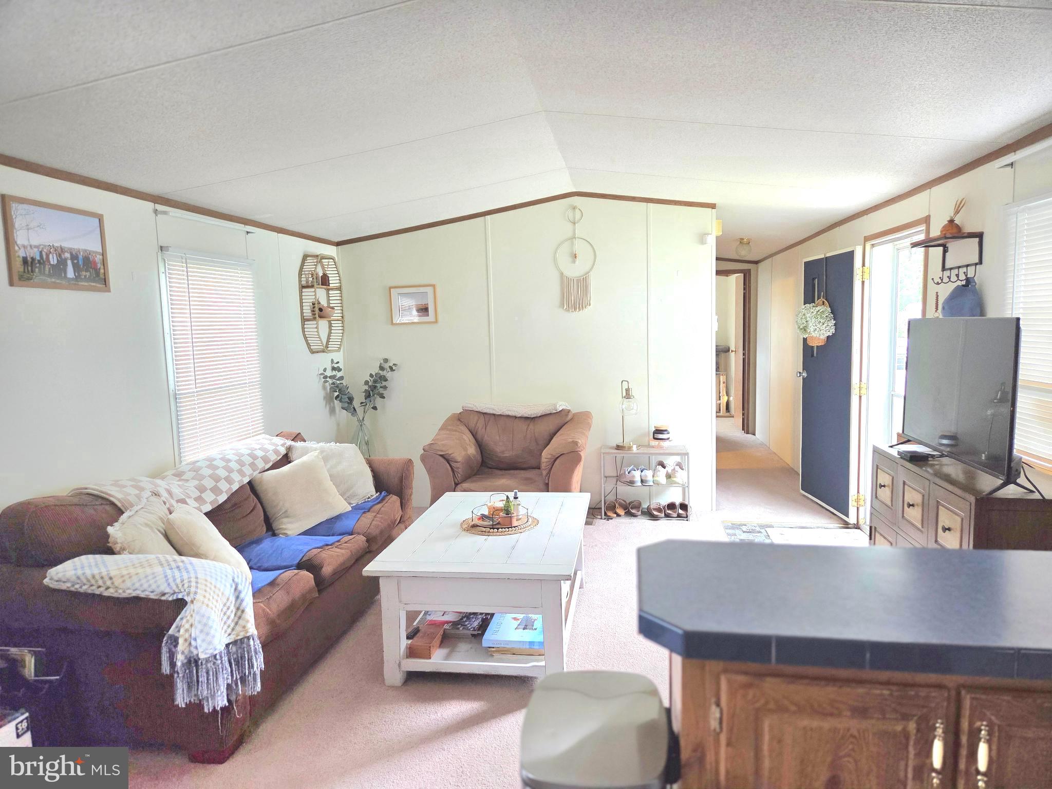 2614 Brian Circle Cambridge, MD 21613 - Photo 5 of 10 a living room with furniture and a flat screen tv