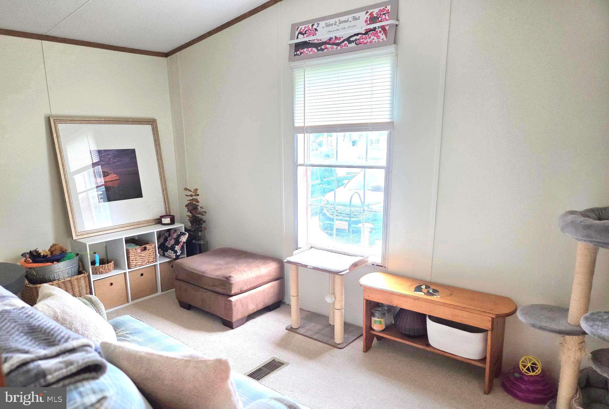 2614 Brian Circle Cambridge, MD 21613 - Photo 8 of 10 a living room with furniture and a window