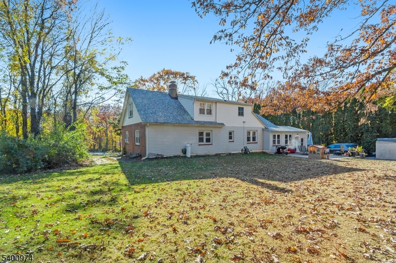 76 Ridge Road, Unit 2 Oak Ridge, NJ 07438 - Photo 12 of 12 a view of a house with a yard
