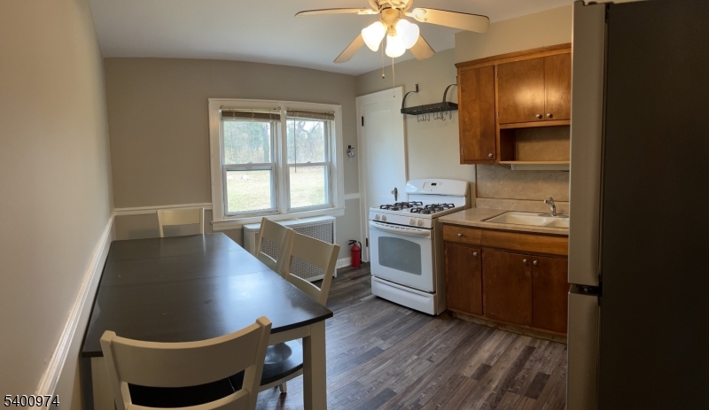 76 Ridge Road, Unit 2 Oak Ridge, NJ 07438 - Photo 8 of 12 a kitchen with sink cabinets and window