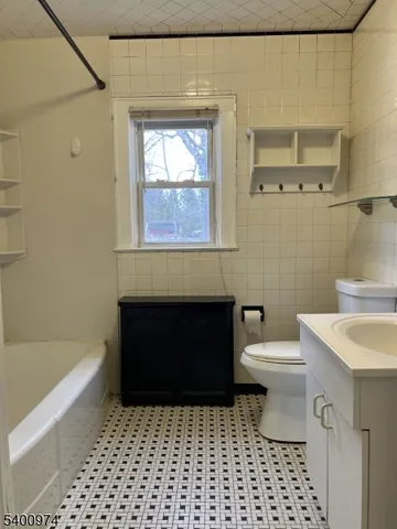 a bathroom with a toilet a sink and a bathtub