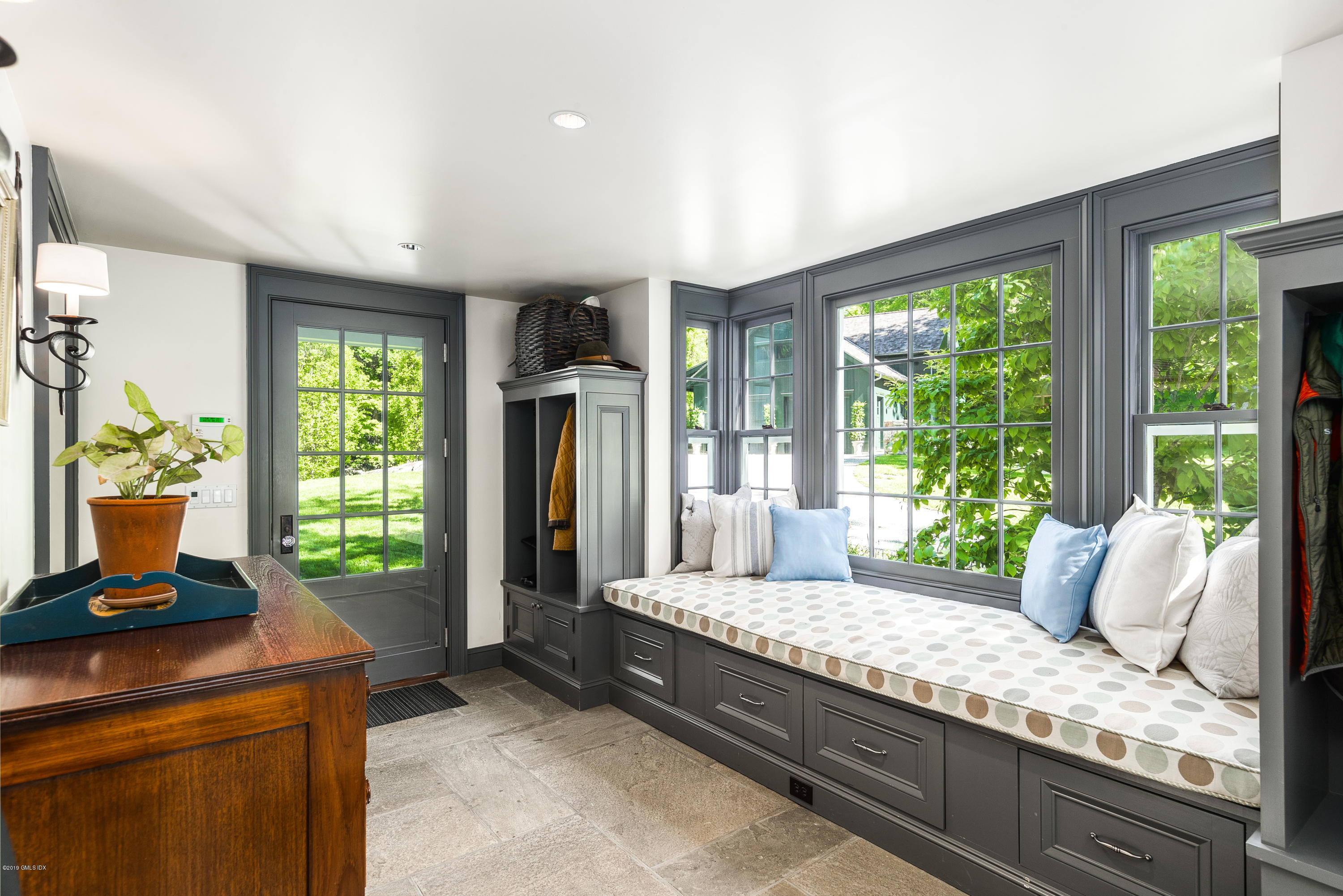 68 Doubling Road Greenwich, CT 06830 - Photo 11 of 40 a living room with couch and a window