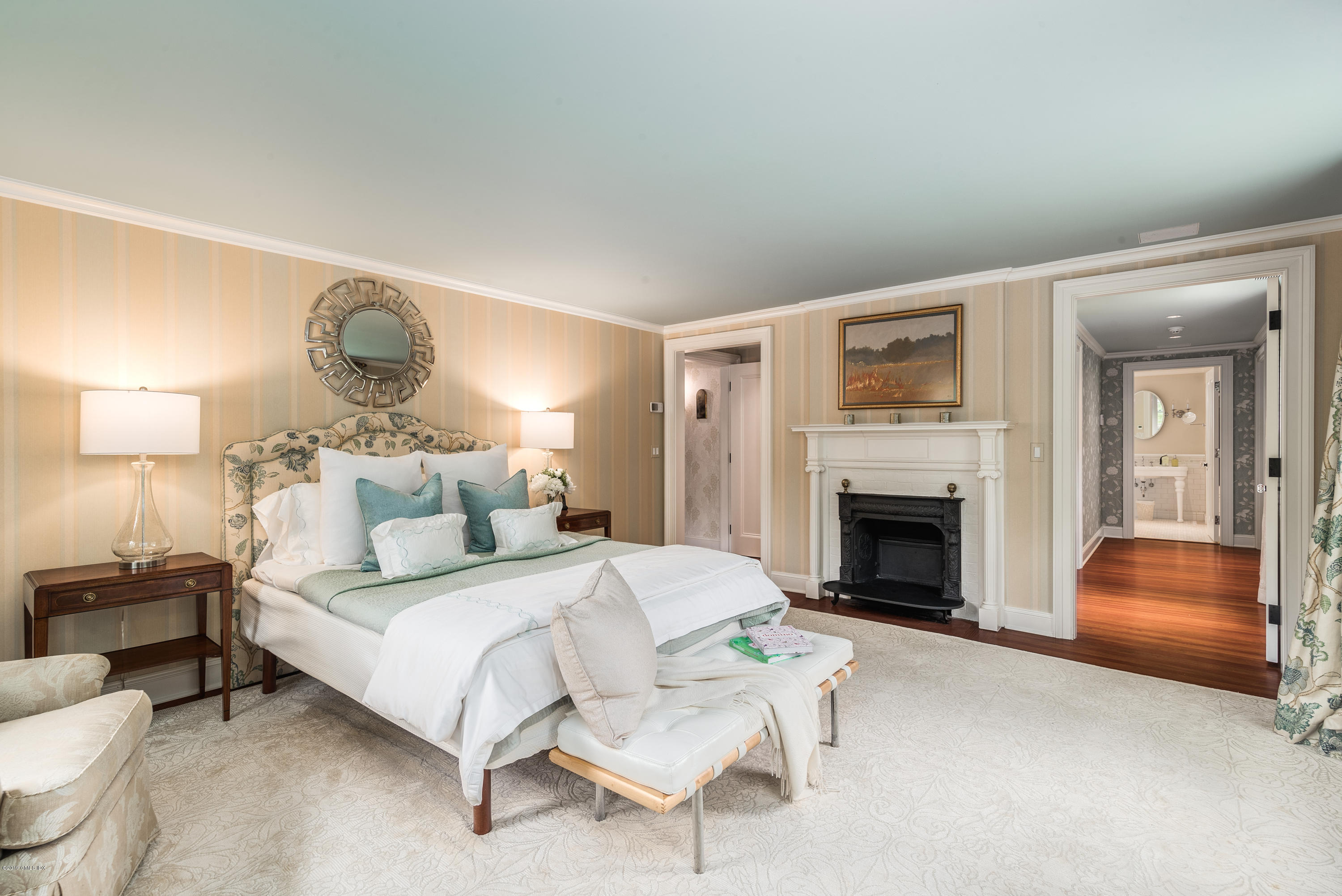 68 Doubling Road Greenwich, CT 06830 - Photo 16 of 40 a bedroom with a bed and a fireplace