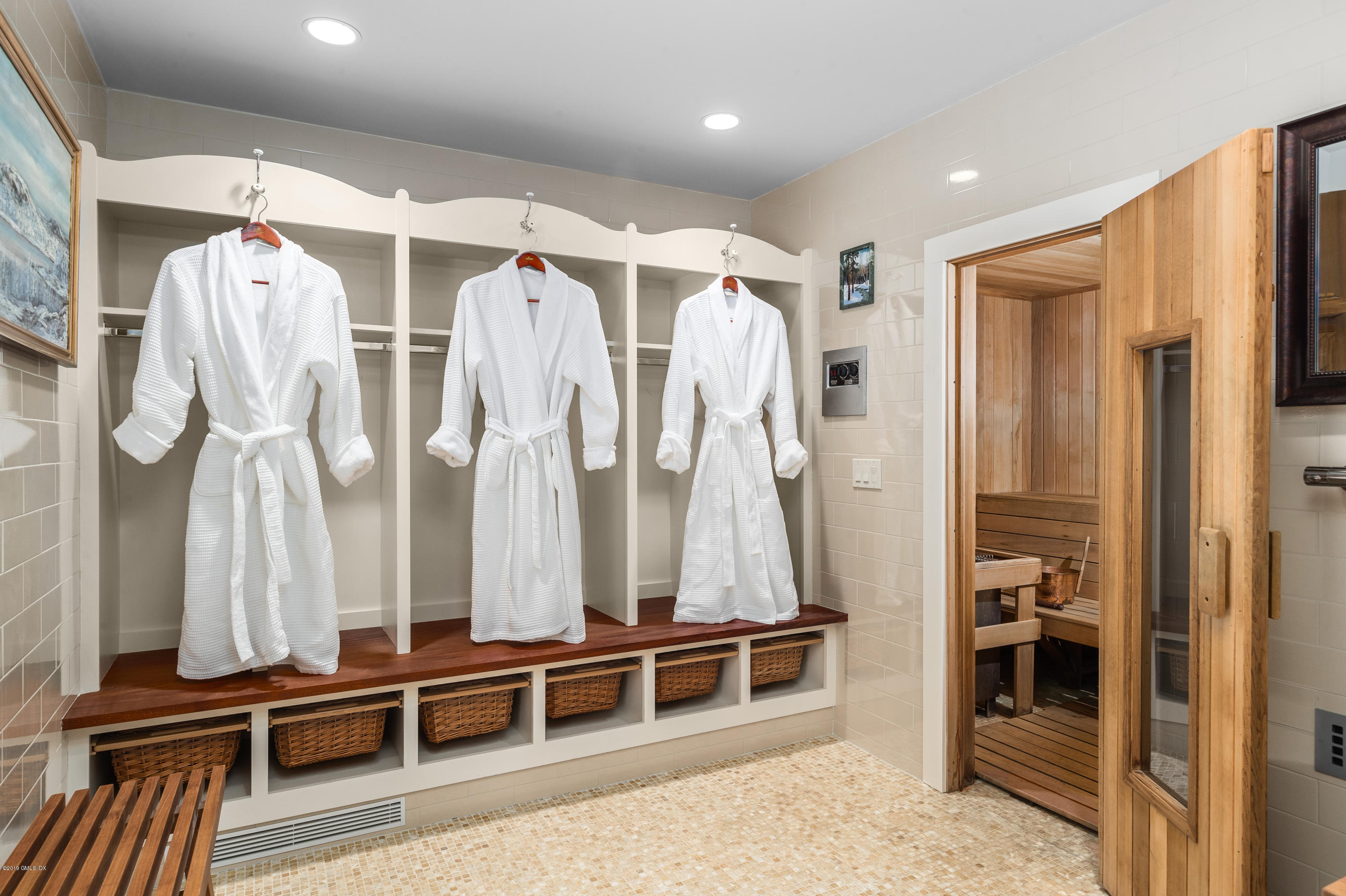 68 Doubling Road Greenwich, CT 06830 - Photo 30 of 40 a view of walk in closet with lots of clothes and shoes