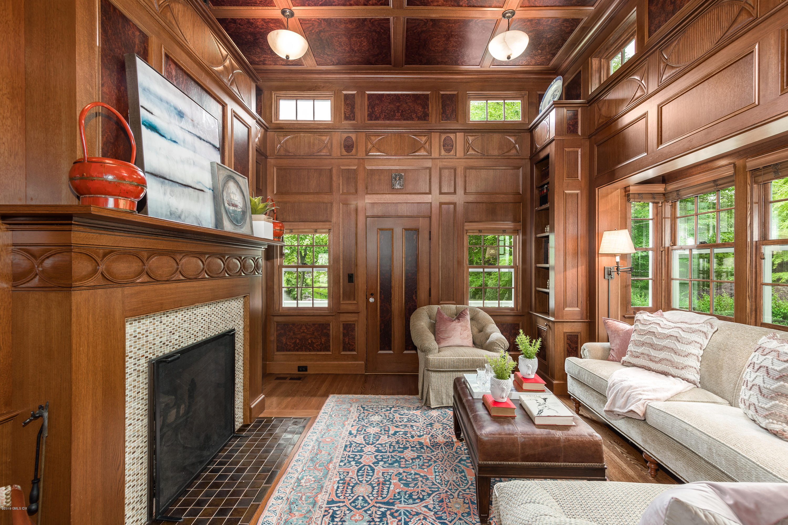 68 Doubling Road Greenwich, CT 06830 - Photo 3 of 40 a living room with furniture a fireplace and a large window