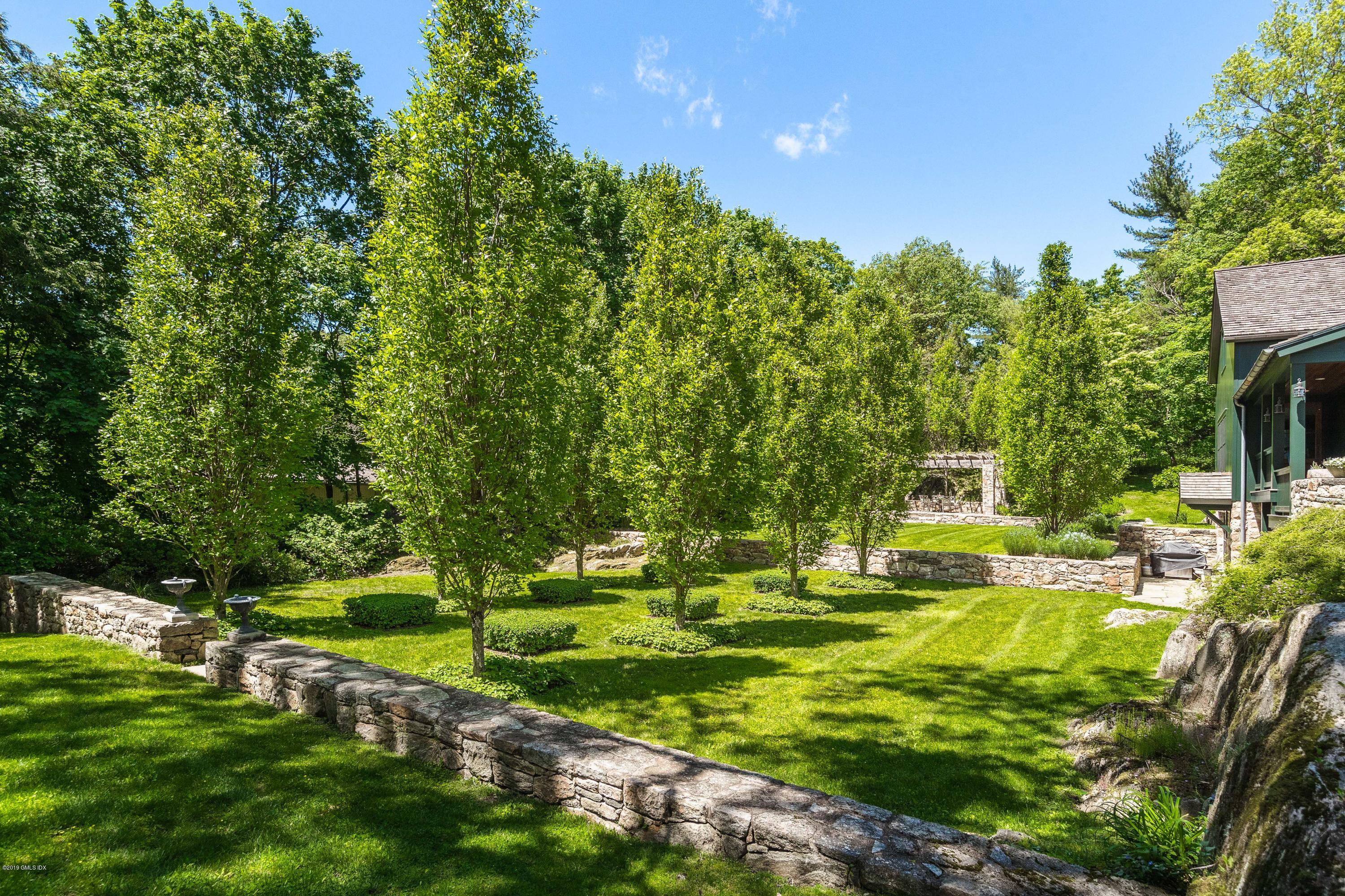 68 Doubling Road Greenwich, CT 06830 - Photo 34 of 40 a view of a golf course with a garden