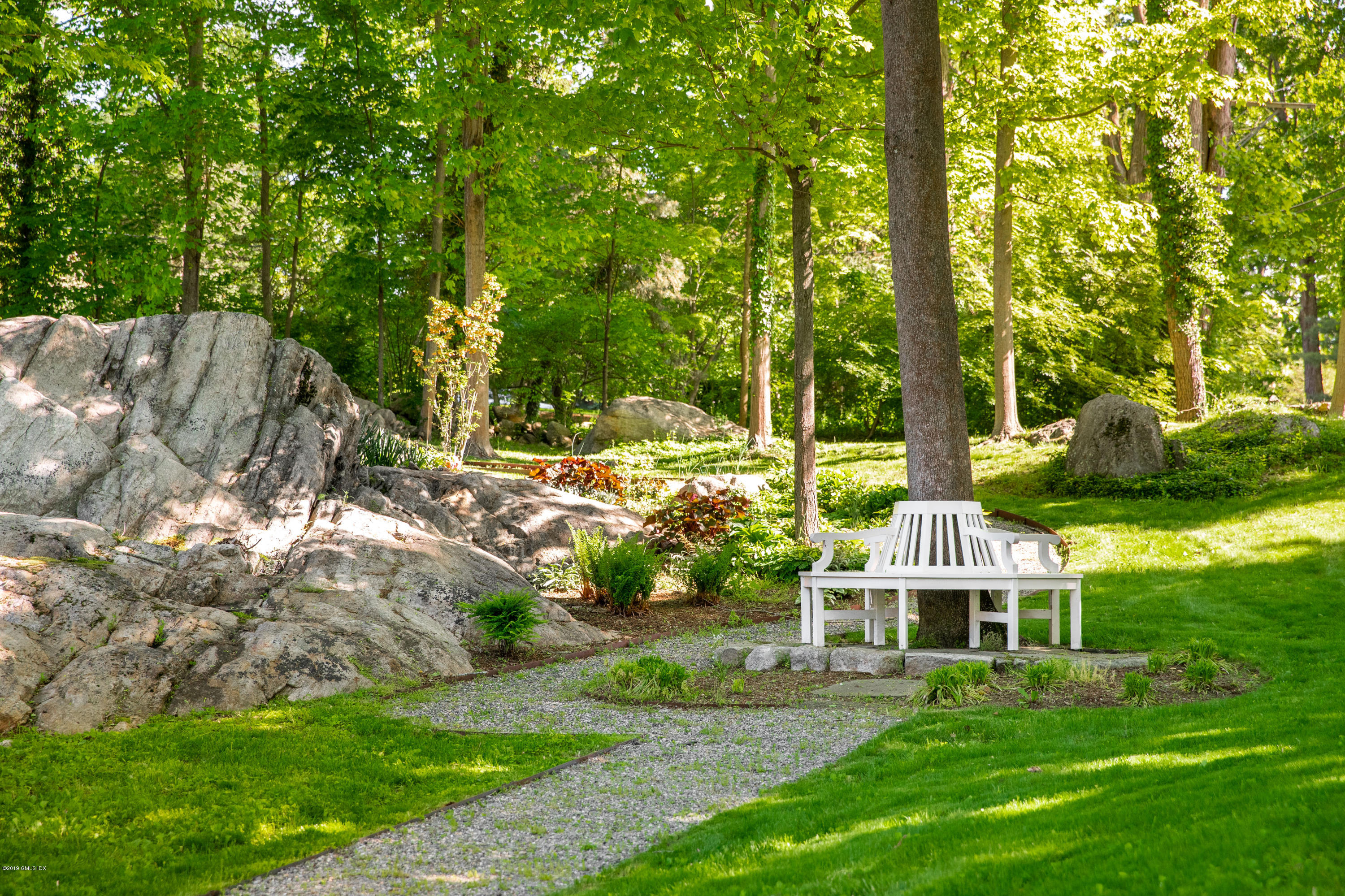 68 Doubling Road Greenwich, CT 06830 - Photo 36 of 40 a front view of a house with a yard