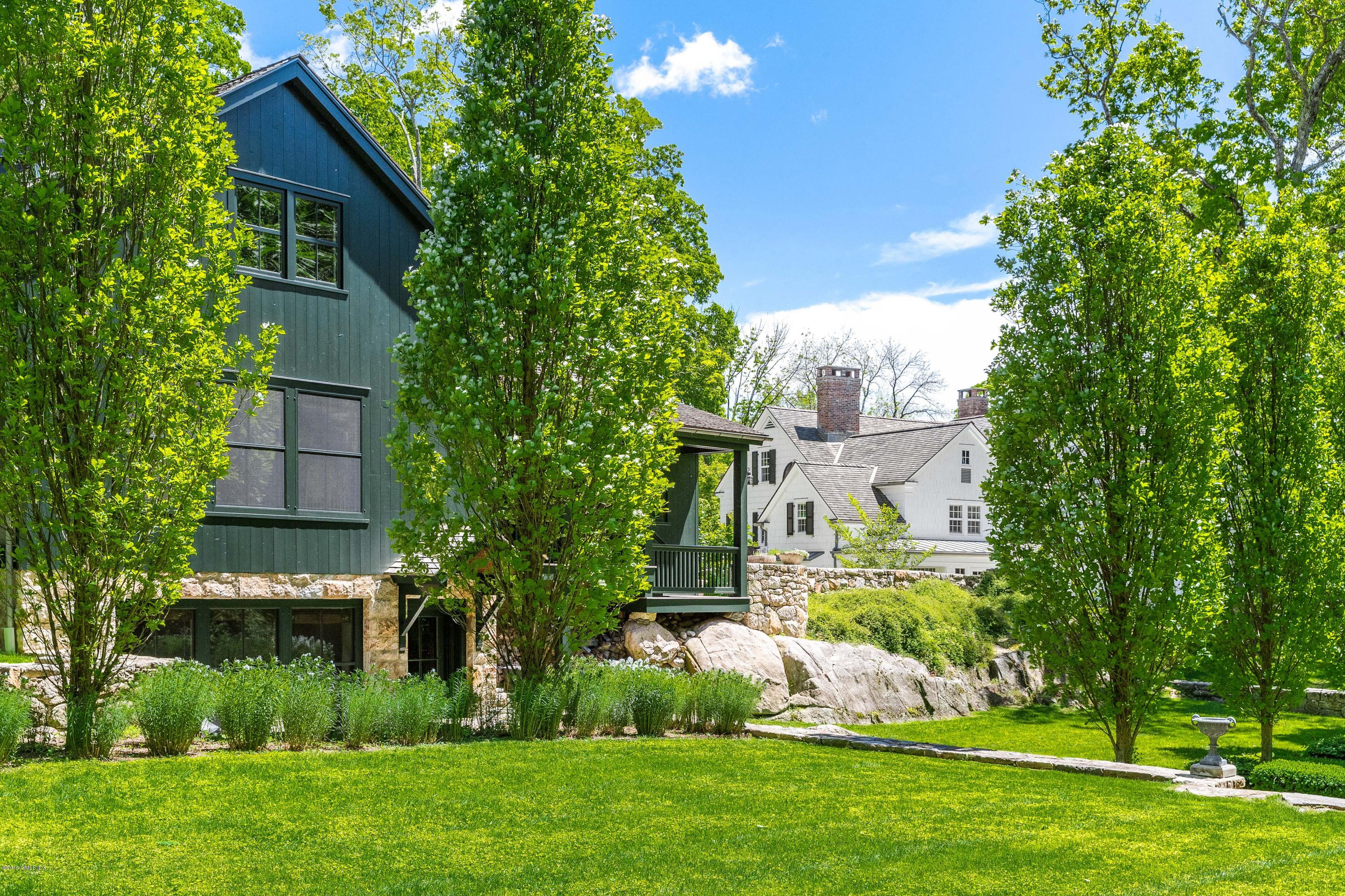 68 Doubling Road Greenwich, CT 06830 - Photo 38 of 40 a front view of a house with garden