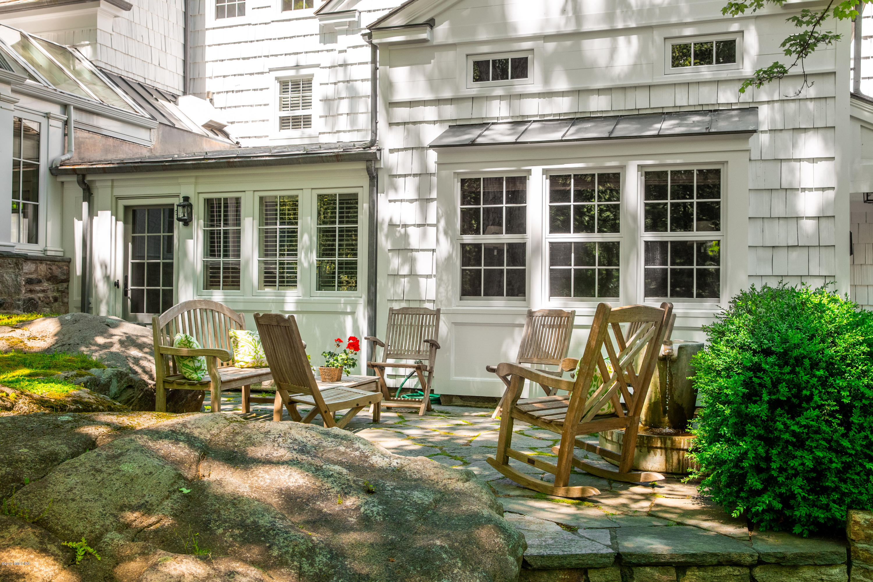 68 Doubling Road Greenwich, CT 06830 - Photo 39 of 40 a view of a house with outdoor seating