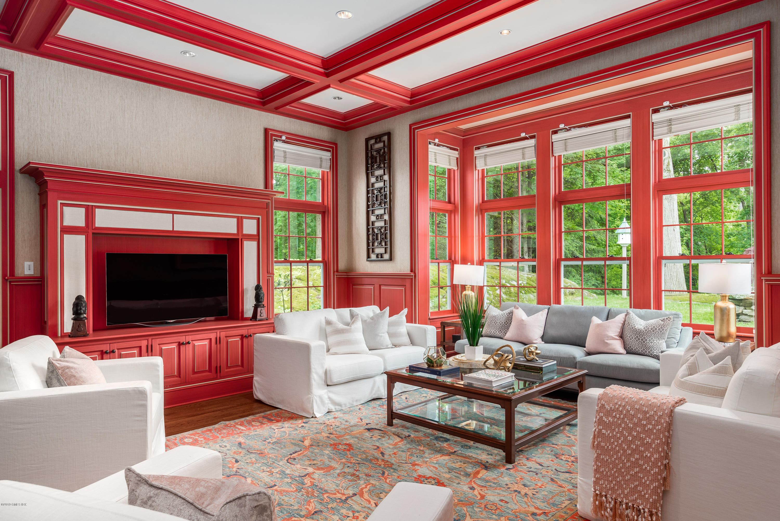 68 Doubling Road Greenwich, CT 06830 - Photo 8 of 40 a living room with furniture a large window and a flat screen tv