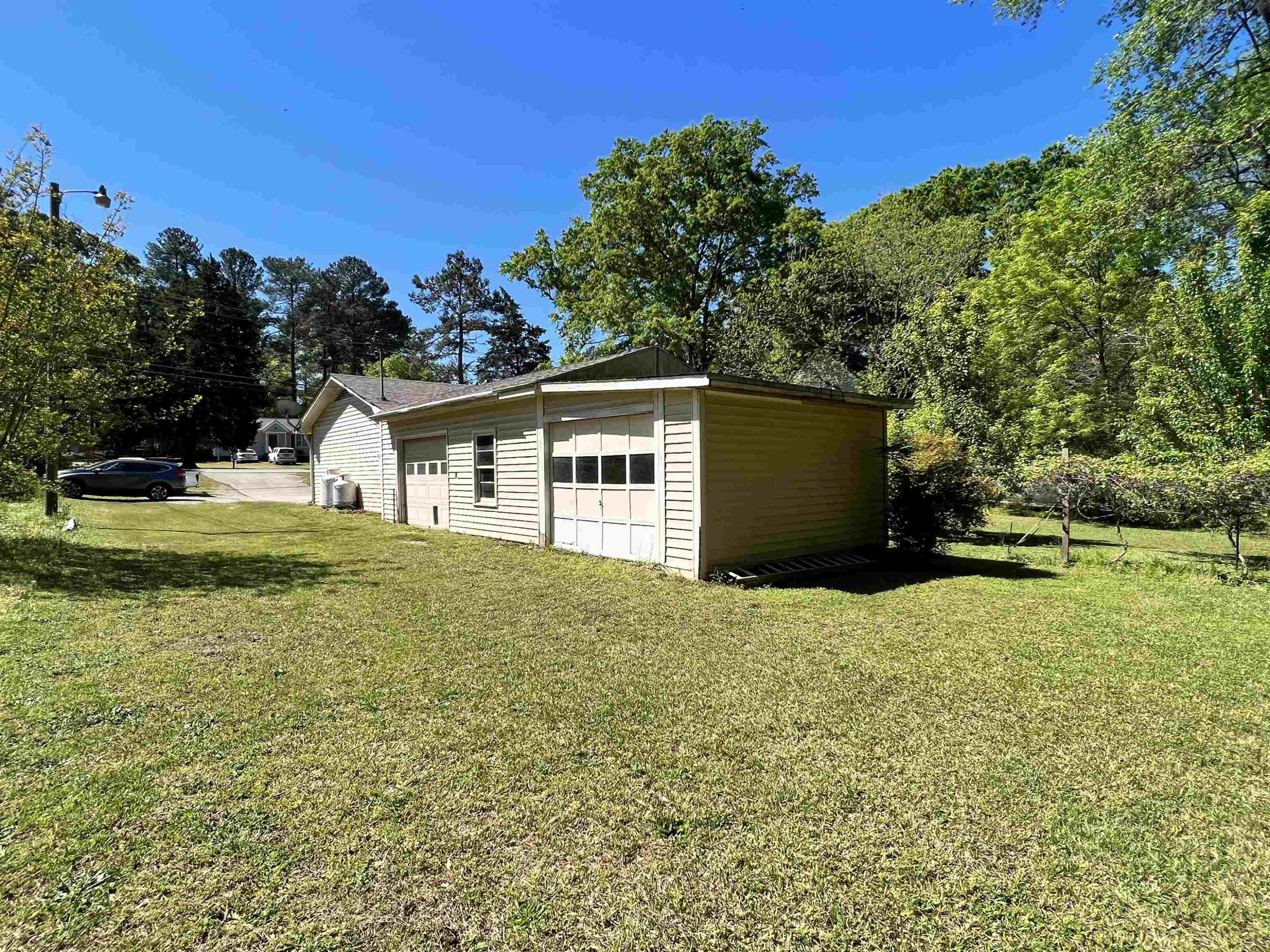 624 Woodland Road Raleigh, NC 27603 - Photo 29 of 29 a backyard of a house with lots of green space