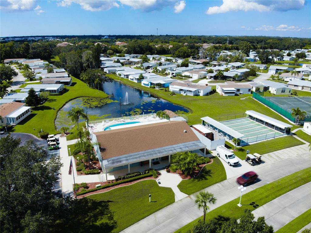 76 Eagle Circle Ellenton, FL 34222 - Photo 24 of 25 an aerial view of a house with a swimming pool yard and mountain view in back