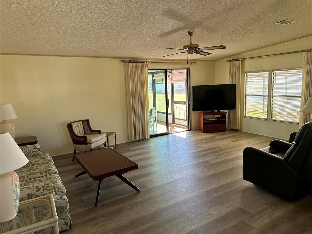 76 Eagle Circle Ellenton, FL 34222 - Photo 4 of 22 a living room with furniture and a flat screen tv