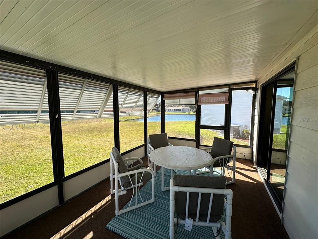 76 Eagle Circle Ellenton, FL 34222 - Photo 5 of 22 a view of a dining room with furniture window and wooden floor