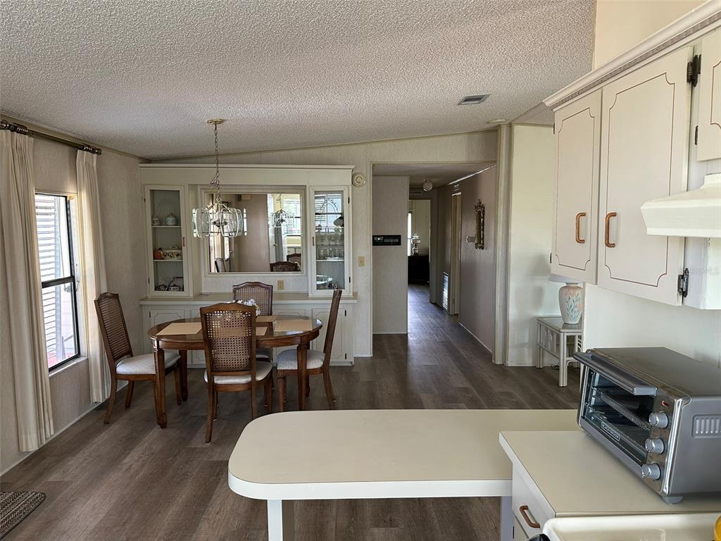 76 Eagle Circle Ellenton, FL 34222 - Photo 10 of 22 a view of a dining room with furniture and wooden floor