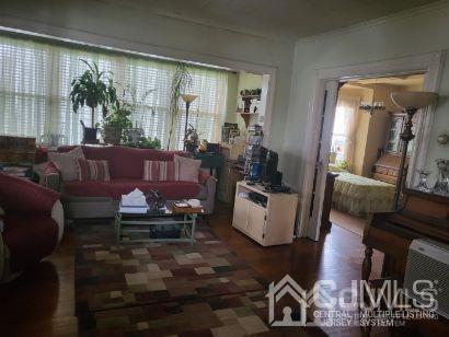 352 Front Street Dunellen, NJ 08812 - Photo 11 of 46 a living room with furniture and a large window
