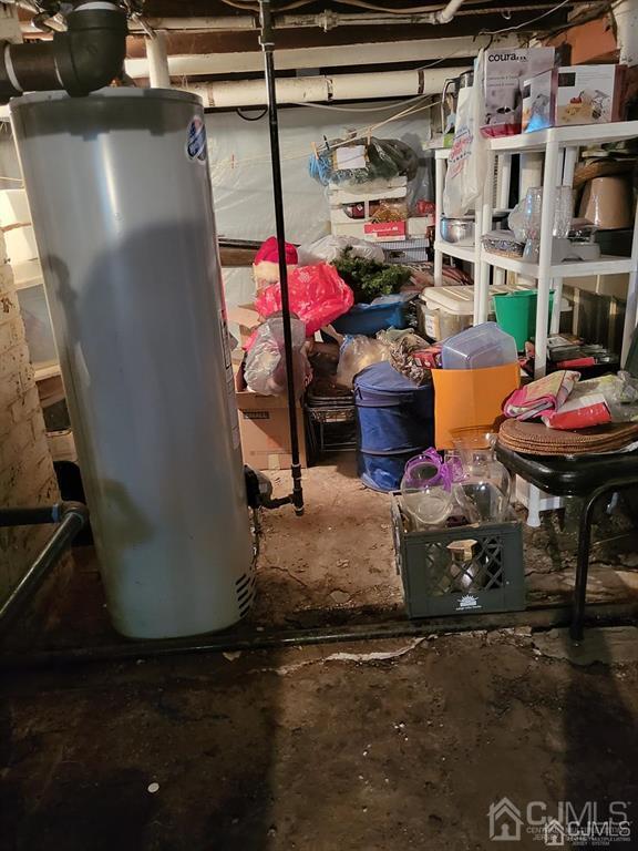352 Front Street Dunellen, NJ 08812 - Photo 24 of 46 a room with water heater and wooden racks