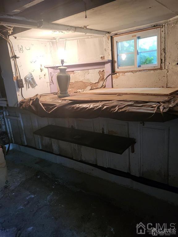 352 Front Street Dunellen, NJ 08812 - Photo 25 of 46 a living room with a bed next to a window