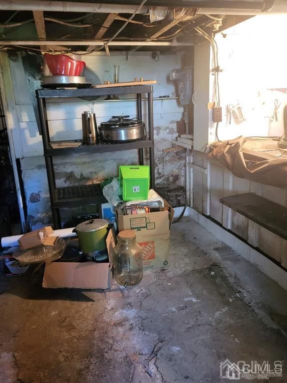 352 Front Street Dunellen, NJ 08812 - Photo 26 of 46 a living room with furniture and a fireplace