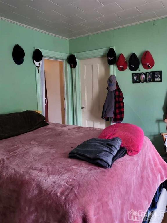352 Front Street Dunellen, NJ 08812 - Photo 32 of 46 a bedroom with a bed and a window