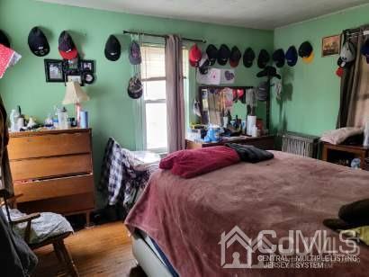 352 Front Street Dunellen, NJ 08812 - Photo 34 of 46 a bedroom with a bed and closet