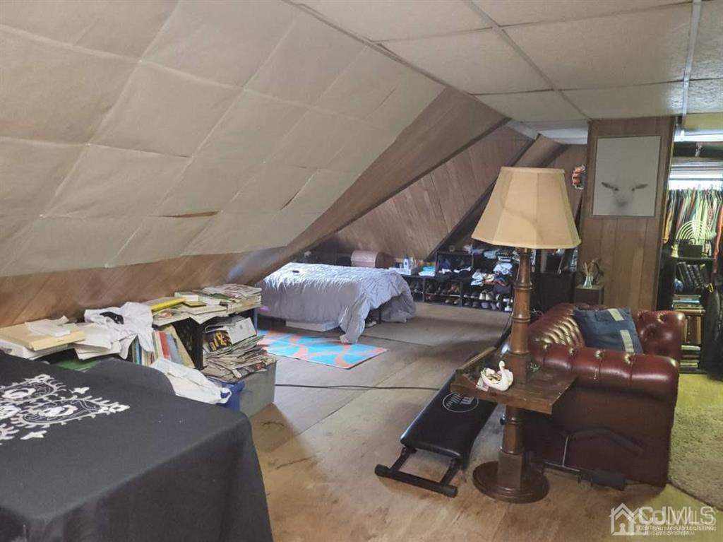 352 Front Street Dunellen, NJ 08812 - Photo 44 of 46 a living room with furniture and a lamp