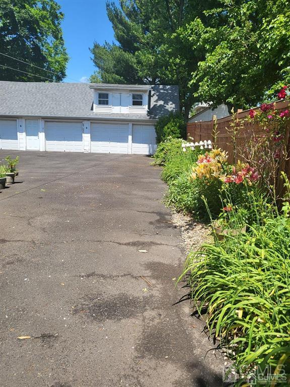 352 Front Street Dunellen, NJ 08812 - Photo 6 of 46 a front view of a house with a yard and a garage