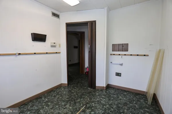 a view of a storage & utility room with a window