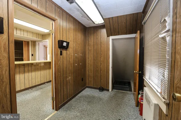 a view of a hallway with a door