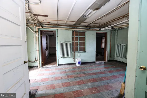 a view of a room with furniture and a window