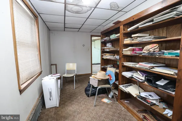 a room that has a bed and a chair in it