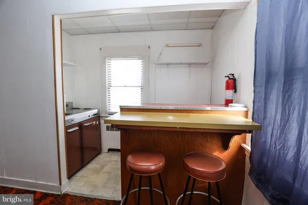 a kitchen with a stove and a window