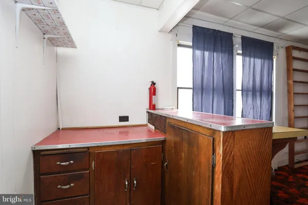 a bathroom with a sink toilet and mirror