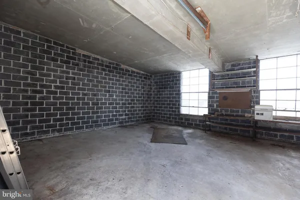 a view of empty room with windows