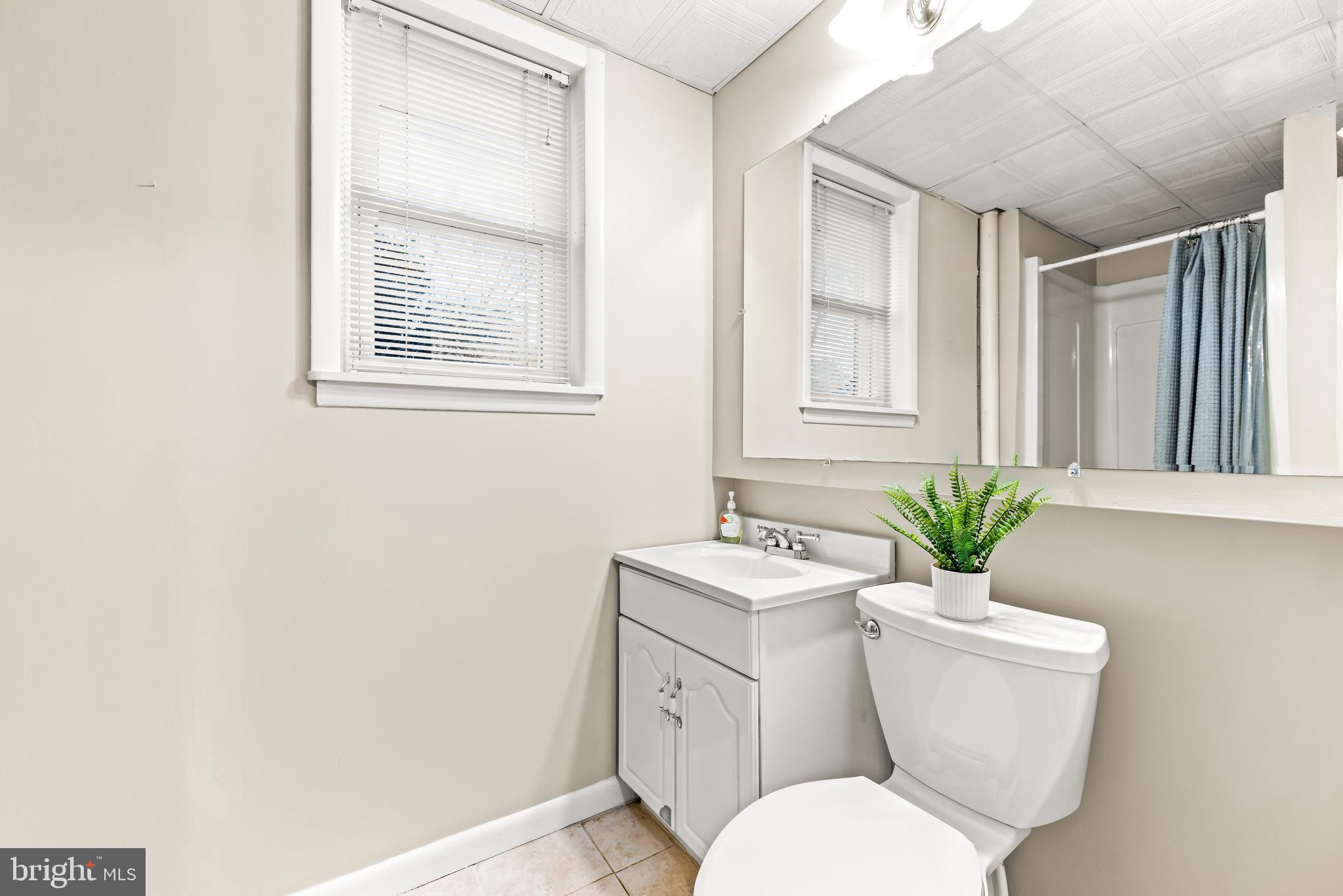 1205 Mill Creek Road Fallston, MD 21047 - Photo 39 of 53 a bathroom with a toilet a sink and a window