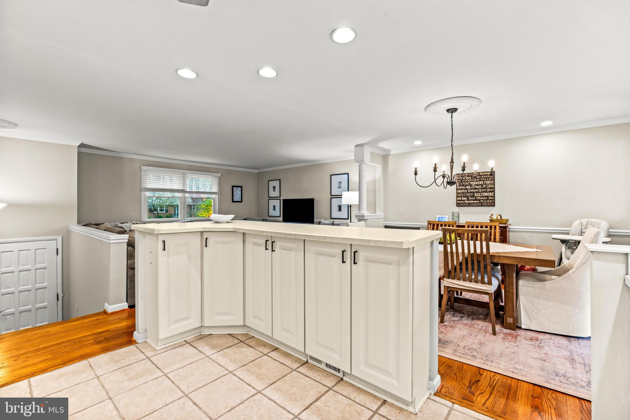 1205 Mill Creek Road Fallston, MD 21047 - Photo 10 of 53 a kitchen with white cabinets and chairs