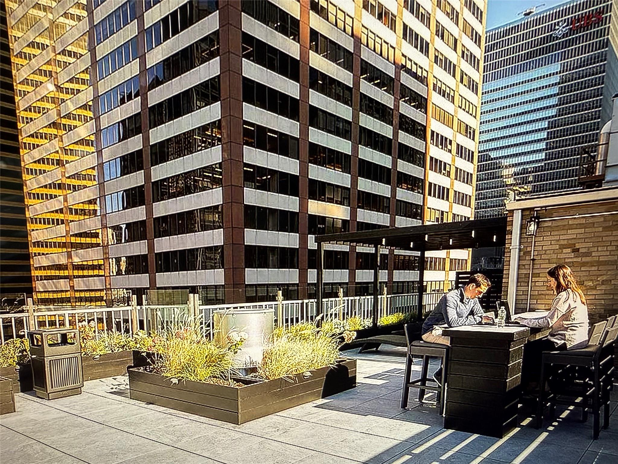 150 West 51st Street, Unit 1032 Manhattan, NY 10019 - Photo 12 of 19 a view of a patio with couches and potted plants