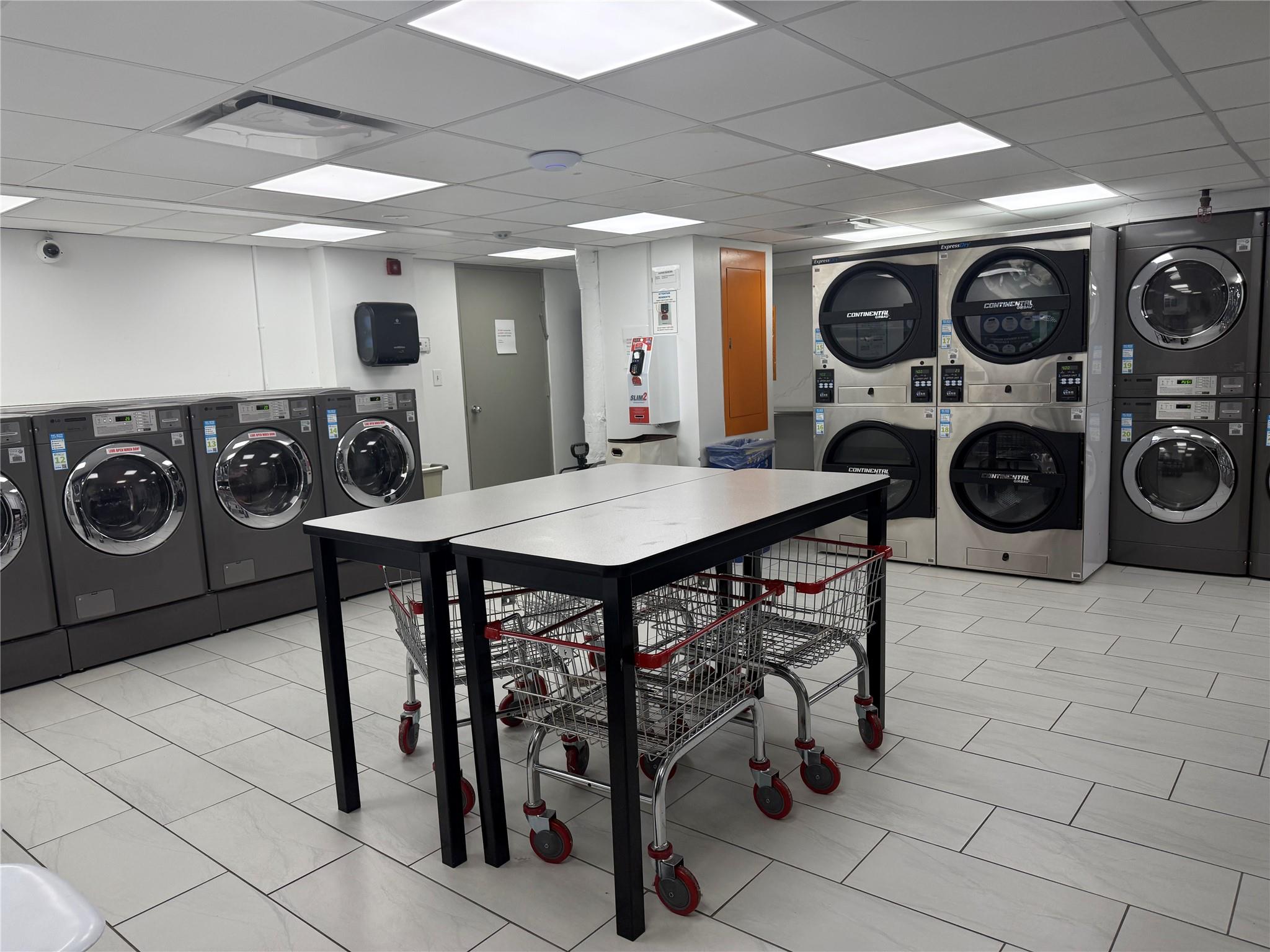 150 West 51st Street, Unit 1032 Manhattan, NY 10019 - Photo 14 of 19 a view of a table and chairs in a room