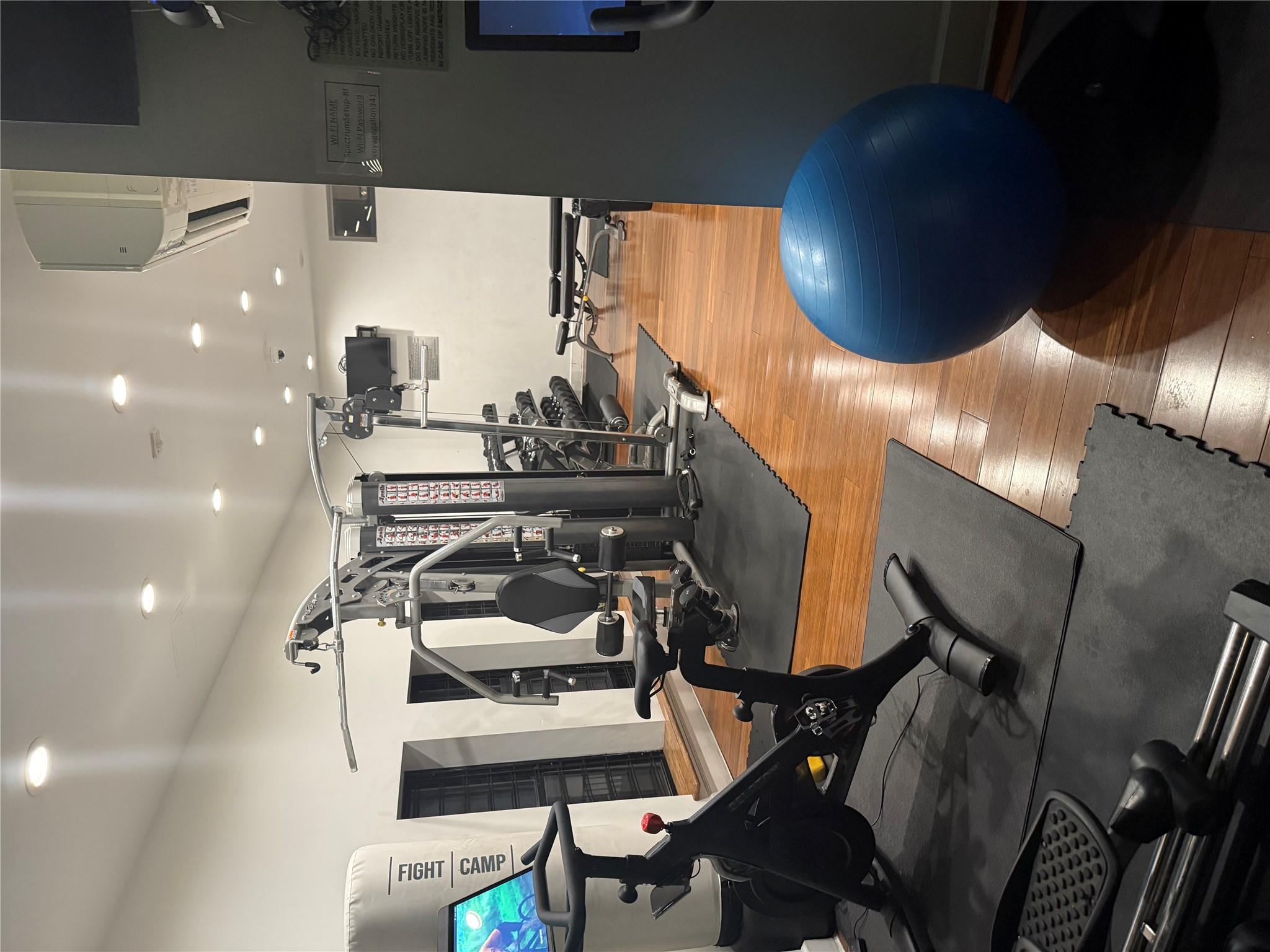 150 West 51st Street, Unit 1032 Manhattan, NY 10019 - Photo 15 of 19 a view of a room with gym equipment