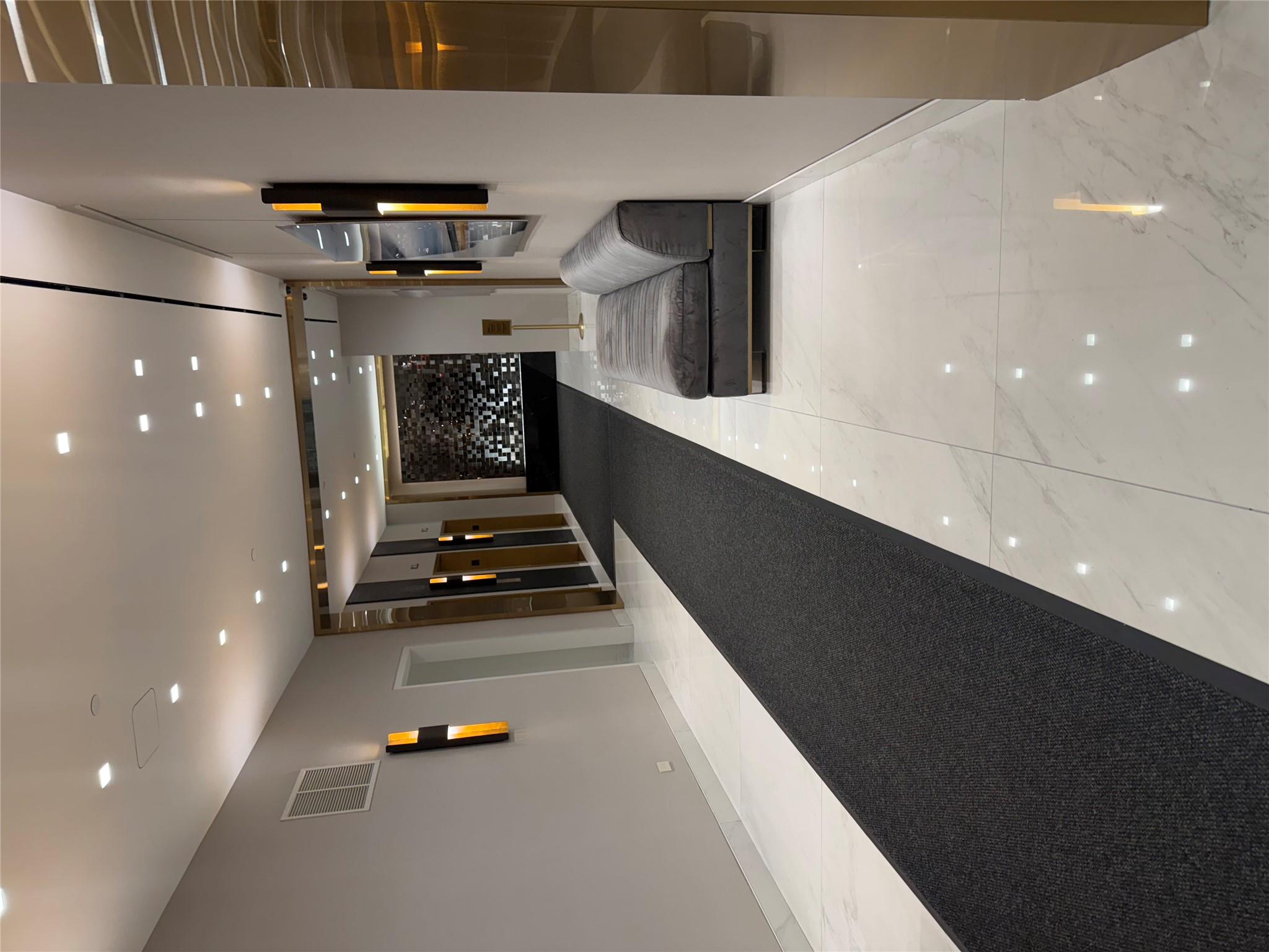 150 West 51st Street, Unit 1032 Manhattan, NY 10019 - Photo 18 of 19 a living room with furniture and a flat screen tv