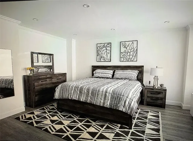 a bedroom with a bed and a desk