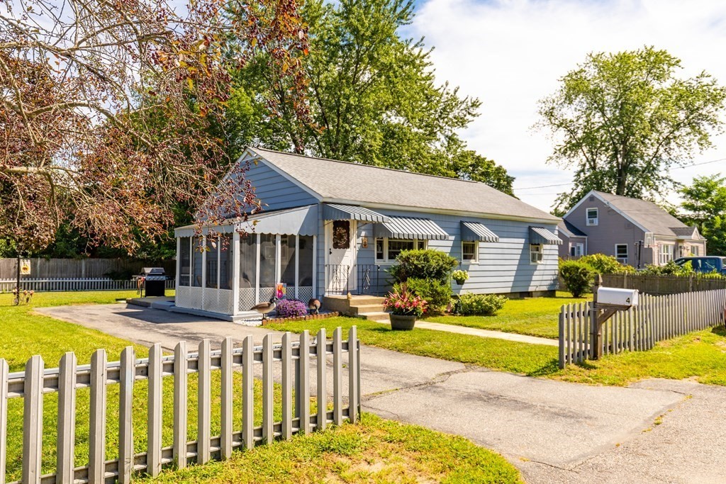 a front view of house with yard and patio area