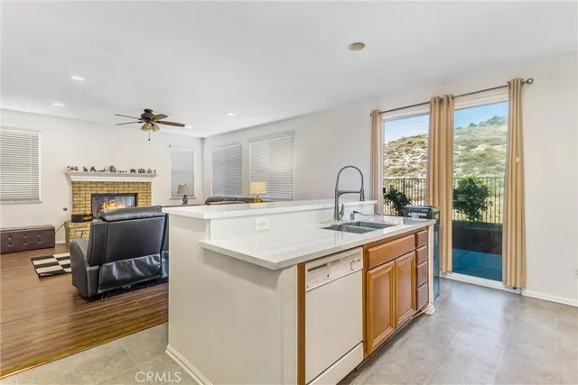 a kitchen with a stove a sink and a refrigerator