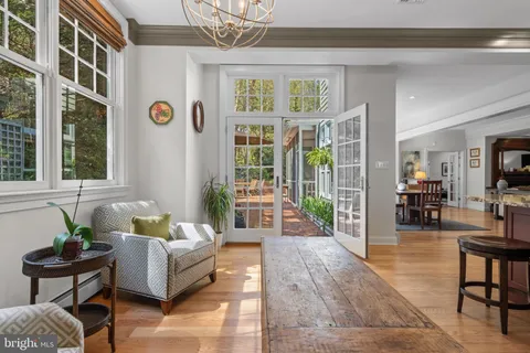 a living room with furniture wooden floor and a table